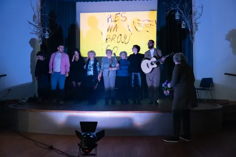Performers bowing onstage